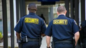 Security staff in dark blue uniforms